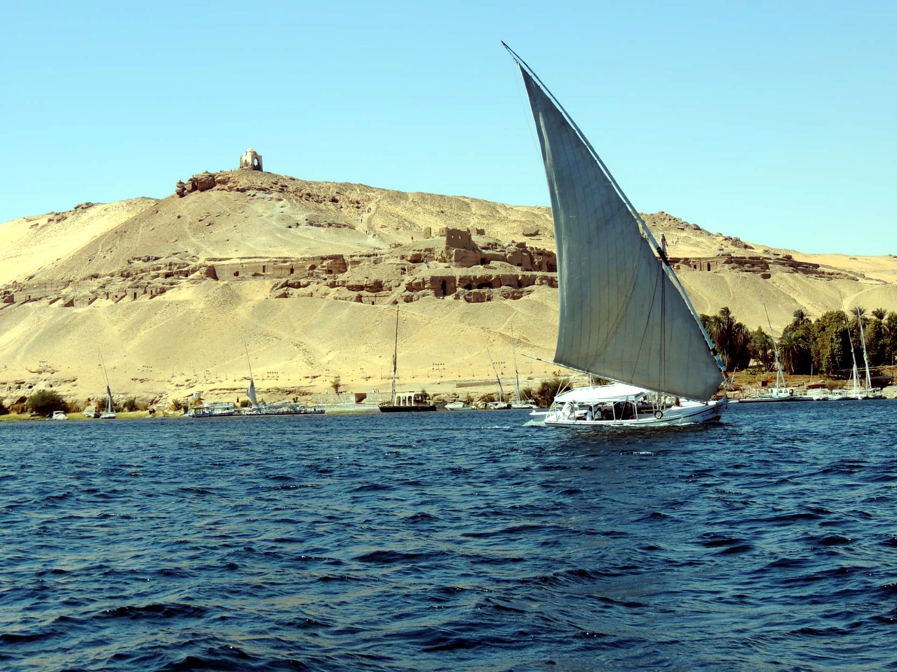 Felucca below the Tombs of the Nobles, Aswan, Egypt