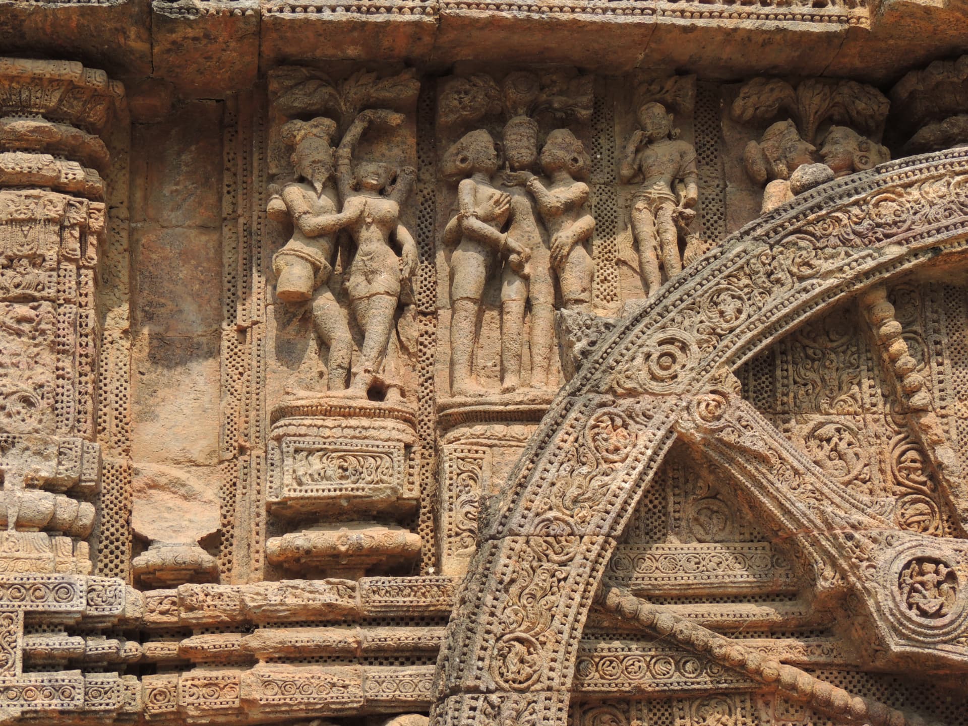 Figures beside the Chariot Wheel, Konark, Odisha